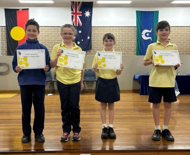 Public speaking winners holding certificates